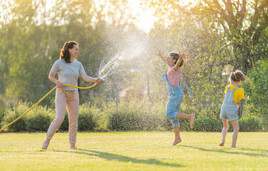 Happy family playing in backyard