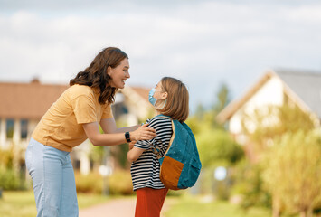Fototapeta premium Parent and pupils going to school