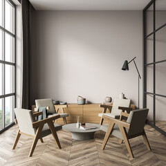 Bright waiting room interior with four cozy armchairs