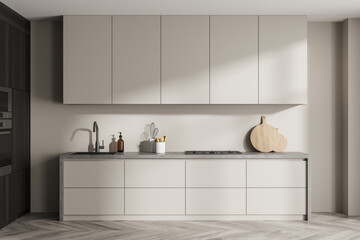 Closeup kitchen cabinet with grey worktop and dark wood detail