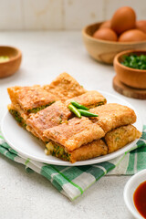 Martabak Telor or Martabak Telur. Savory pan-fried pastry stuffed with egg, meat and spices.