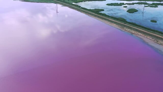 Lake Lemuria - Pink Lake is a lake in the Kherson region of Ukraine. It has pink water due to the action of an algae which produces large amounts of beta-carotene. Aerial view