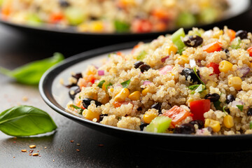 Quinoa black bean salad with corn, red green pepper, onion. Healthy food.
