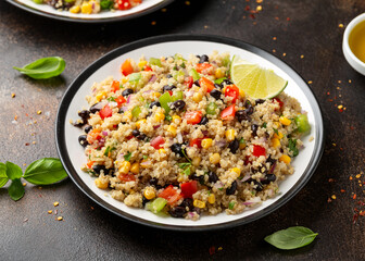 Quinoa black bean salad with corn, red green pepper, onion. Healthy food.