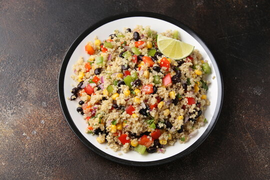 Quinoa black bean salad with corn, red green pepper, onion. Healthy food.