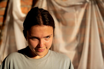 Obraz premium Portrait of sporty сute teenage girl look tired after workout on white background. Hot weather.