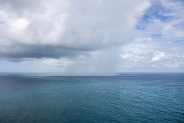 Raining clouds over the sea