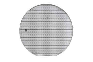A microcircuit of a powerful Darlington transistor on a cut scribed semiconductor silicon multilayer wafer. Semiconductor chip is a crystal of a microcircuit without a package