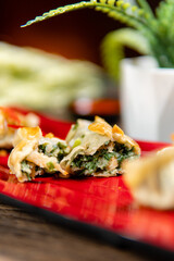 Gyoza are identical to jiaozi made in Chinese households using store bought machine made wrappers. Gyoza are usually served with soy based tare sauce seasoned with rice vinegar and chili oil.