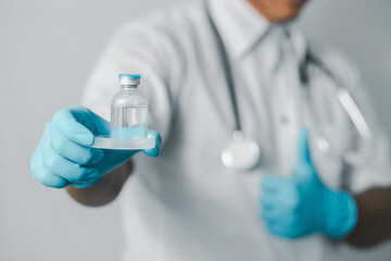 Fototapeta premium Doctor or scientist in sanitary uniform showing coronavirus vaccine, healthcare and medical concept. 