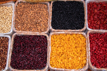 A set of dried berries. The counter is on the market with dried berries.