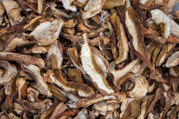 Heap of dried edible mushrooms on the market