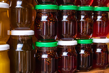 Pine cones in honey. Glass jars of pine cone jam