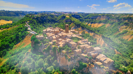 Panoramic aerial view of Civita di Bagnoregio from a flying drone around the medieval city, Italy.