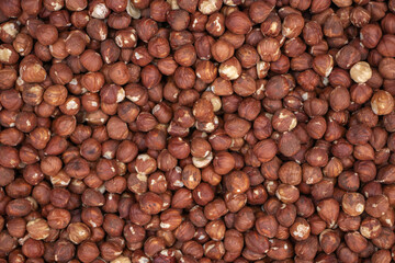 Hazelnut Background. Heap of peeled hazelnuts.