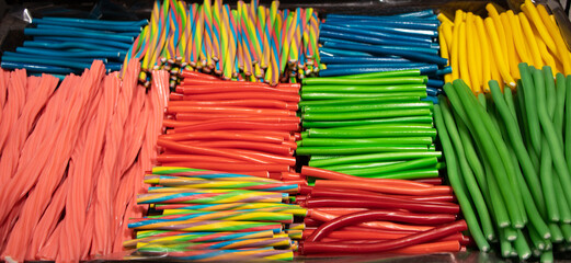 Sweet candies rope string shaped sweets dessert food generate a beautiful colorful and interesting...