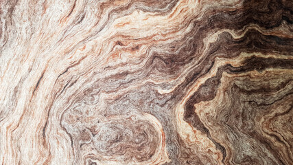 The surface of Sandstone with wavy brown veins. Sulphide agate texture. Wide image of brown natural stone texture Sphalerite. Beautiful wavy pattern of cut of Schalenblende stone close-up