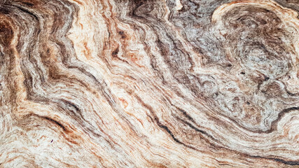 The surface of Sandstone with wavy brown veins. Sulphide agate texture. Wide image of brown natural stone texture Sphalerite. Beautiful wavy pattern of cut of Schalenblende stone close-up