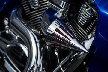 Closeup of harley davidson chromed engine on motorbike parked in the street