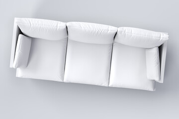 Monochrome couch with pillows on studio white background.