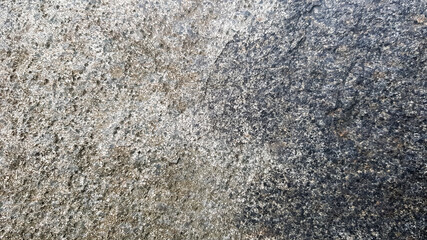 stone texture or background. Coarse cracked stone structure of the face. empty gray stone texture or background