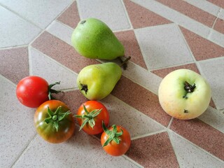 garden gifts on the kitchen table tomatoes apple pear