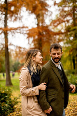 Young couple in the autumn park
