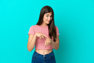 Young Brazilian woman isolated on blue background making the gesture of being late