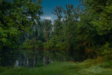 Fog and river Dyje with orange sunrise near Bulhary village in south Moravia