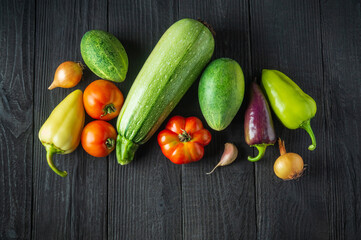 A set of fresh vegetables for a salad diet on a vintage table. Cooking salad in the restaurant kitchen. Free ad space