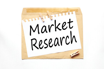 Market Research. text on paper on craft envelope on white background
