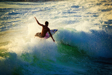 person surfing on the waves