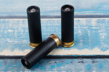 Hunting rifle cartridges. Cartridges on a white isolated background. Cartridges on a wooden table. 