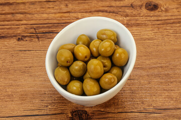 Green pickled olives in the bowl