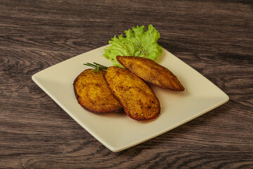 Baked potato with herbs and spices