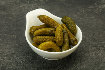 Pickled gherkin in the bowl