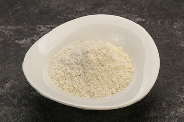 Wheat flour heap in the bowl