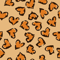 Leopard heart seamless pattern. Vector animal print. Black and orange spots on beige background. Jaguar, leopard, cheetah, panther fur. Leopard skin imitation can be painted on clothes or fabric.