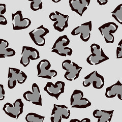 Leopard heart seamless pattern. Vector animal print. Black and grey spots on light grey background. Jaguar, leopard, cheetah, panther fur. Leopard skin imitation can be painted on clothes or fabric.