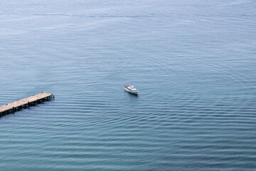 white boat in the azure sea