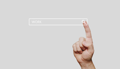 Search bar with work word and man hand presses search button on computer touch screen