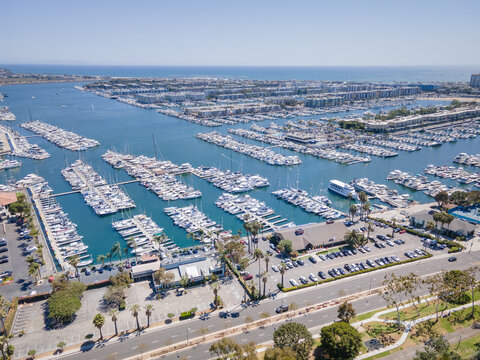 Los Angeles, CA, LA County, June 10, 2021: Aerial Drone Top View of Yacht Clubs at Marina Del Rey with beach, boat pier docks, and apartments by CH
