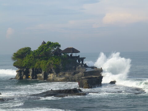waves crashing on rocks at balinese temple tanh lot