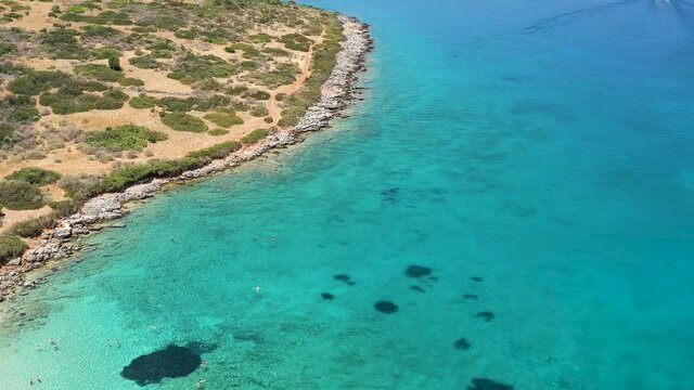 Aerial view of a beautiful island and crystal clear waters in Crete