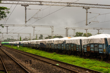 View of a passenger train engine of Indian railways in transit and urban and rural areas in India