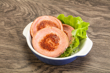 Roasted sausage slice in the plate