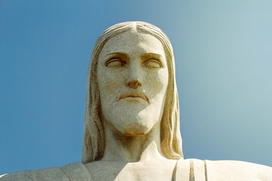 Rio de Janeiro, Brazil - August 23, 2018: Front close-up of the face of the Christ the Redeemer statue under the midday sun