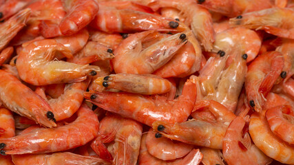 Shrimps background texture. A lot of shrimps. Cooked shrimps.