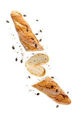 Cutting fresh baked loaf wheat baguette bread flying with sesame and pumpkin seeds isolated on white