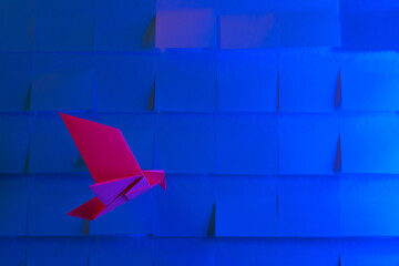 Origami Bird Flying on Paper Sky as a Background